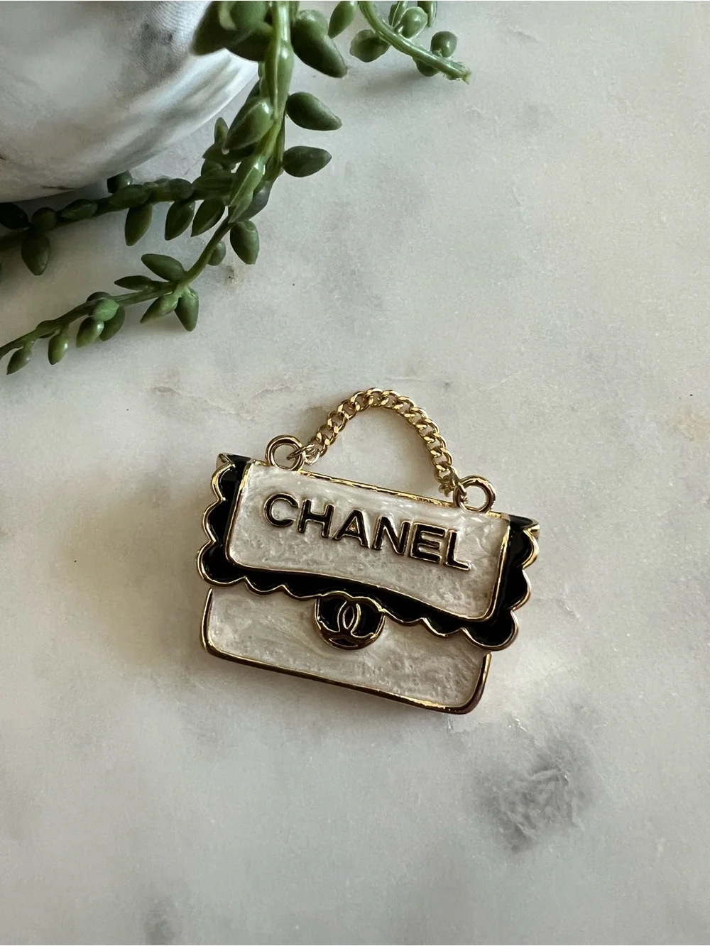 CHANEL White and Black Enamel Bag Charm Pin with Gold Tone